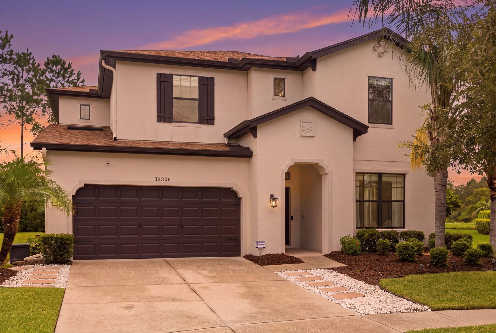 Front of a two-story home at sunset